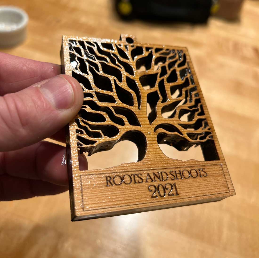 Laser-cut and engraved wood with oil stain