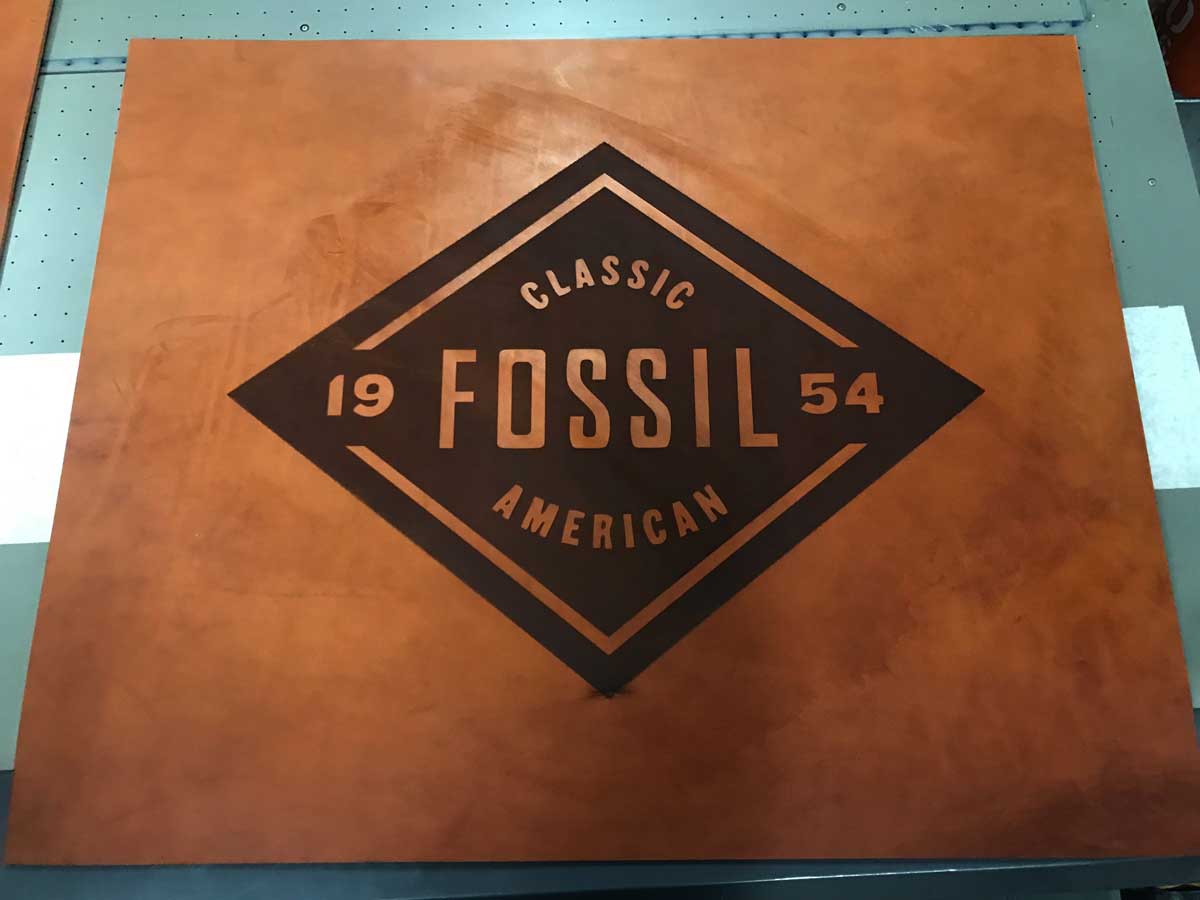Leather cut and laser-engraved logo