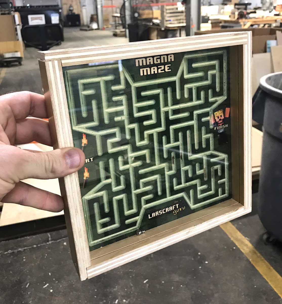 Magnetic maze interactive retail display